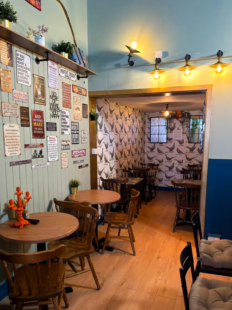 Vintage travel tin signs on the café wall