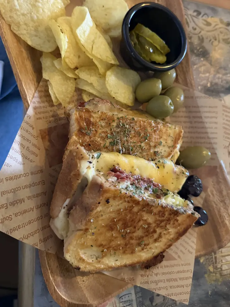Toasted sandwich with a melted cheese pull